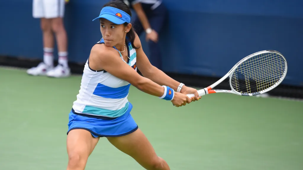 Female tennis player hitting a shot on court