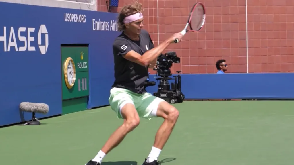 Alexander Zverev driving power from his legs during a forehand follow-through