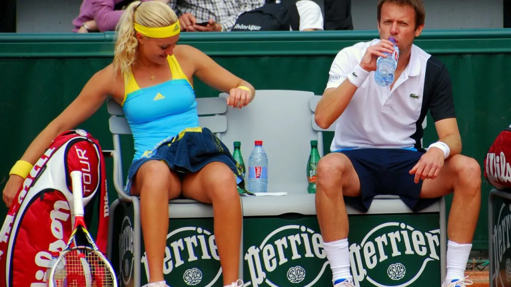 Tennis player resting and recovering focus during a changeover