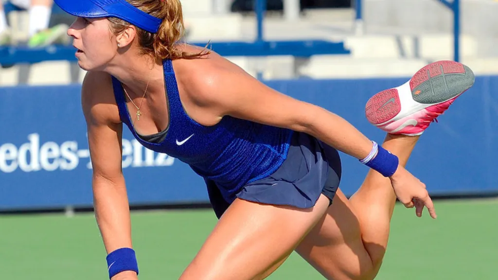 Tennis player preparing to hit a forehand on a hard court