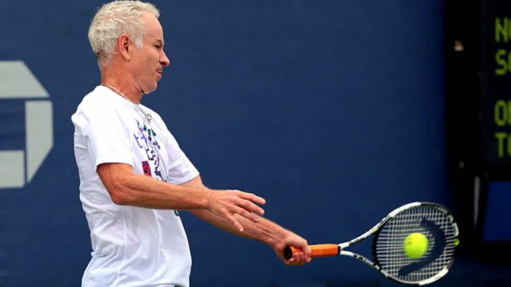 John McEnroe hitting a volley with a continental grip