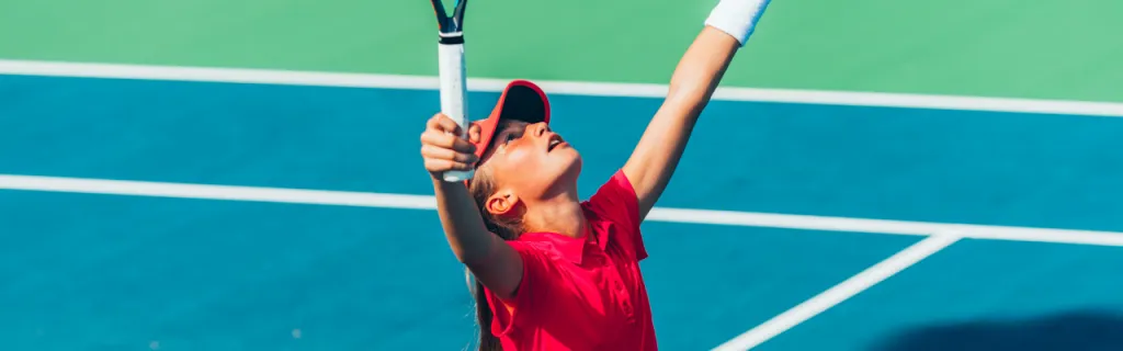 Girls and boys playing junior tennis