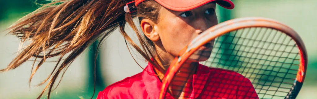 Girls and boys playing tennis together