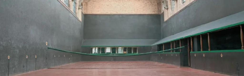 A Real Tennis court at St Andrews, showing the traditional indoor playing surface