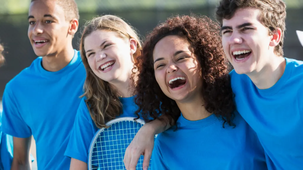 High school students playing team sports together