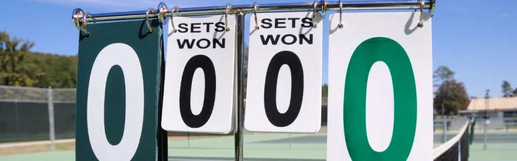 A tennis scoreboard displaying game and set counts for both players during a competitive match